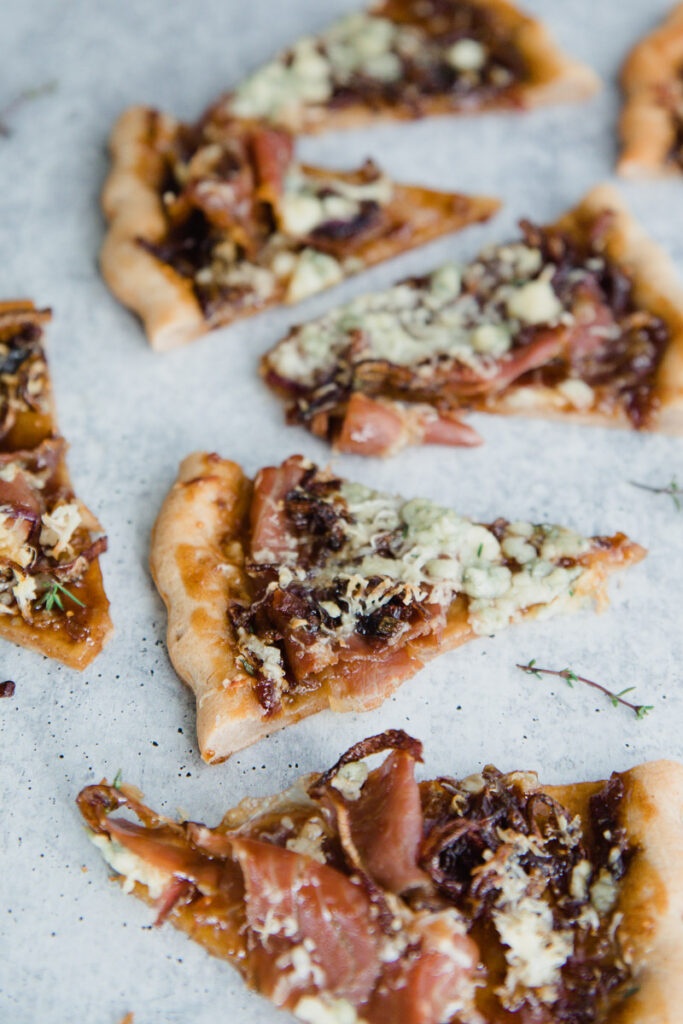 Gorgonzola Fig Flatbread cut into triangles on a marble countertop