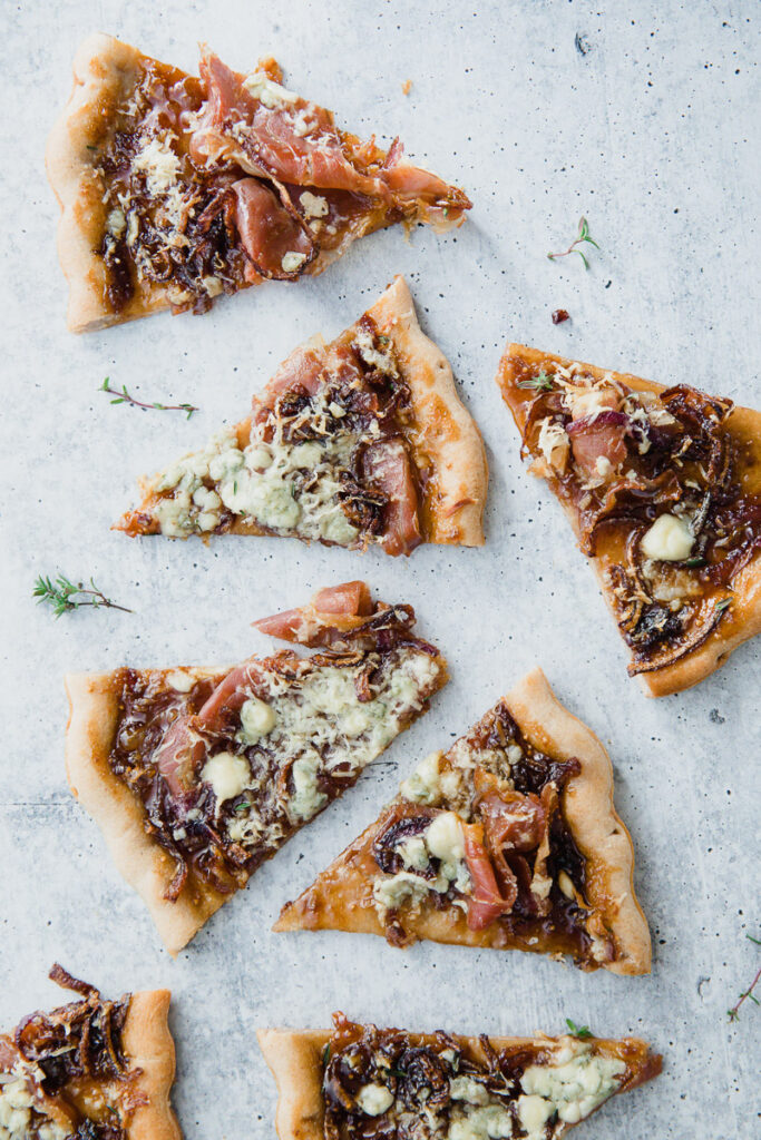 Gorgonzola Fig Flatbread cut into triangles on a marble countertop