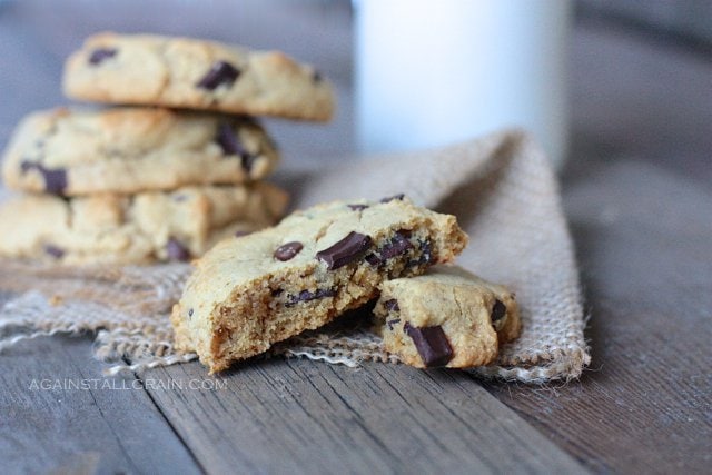 real deal chocolate chip cookies on a board over a napkin