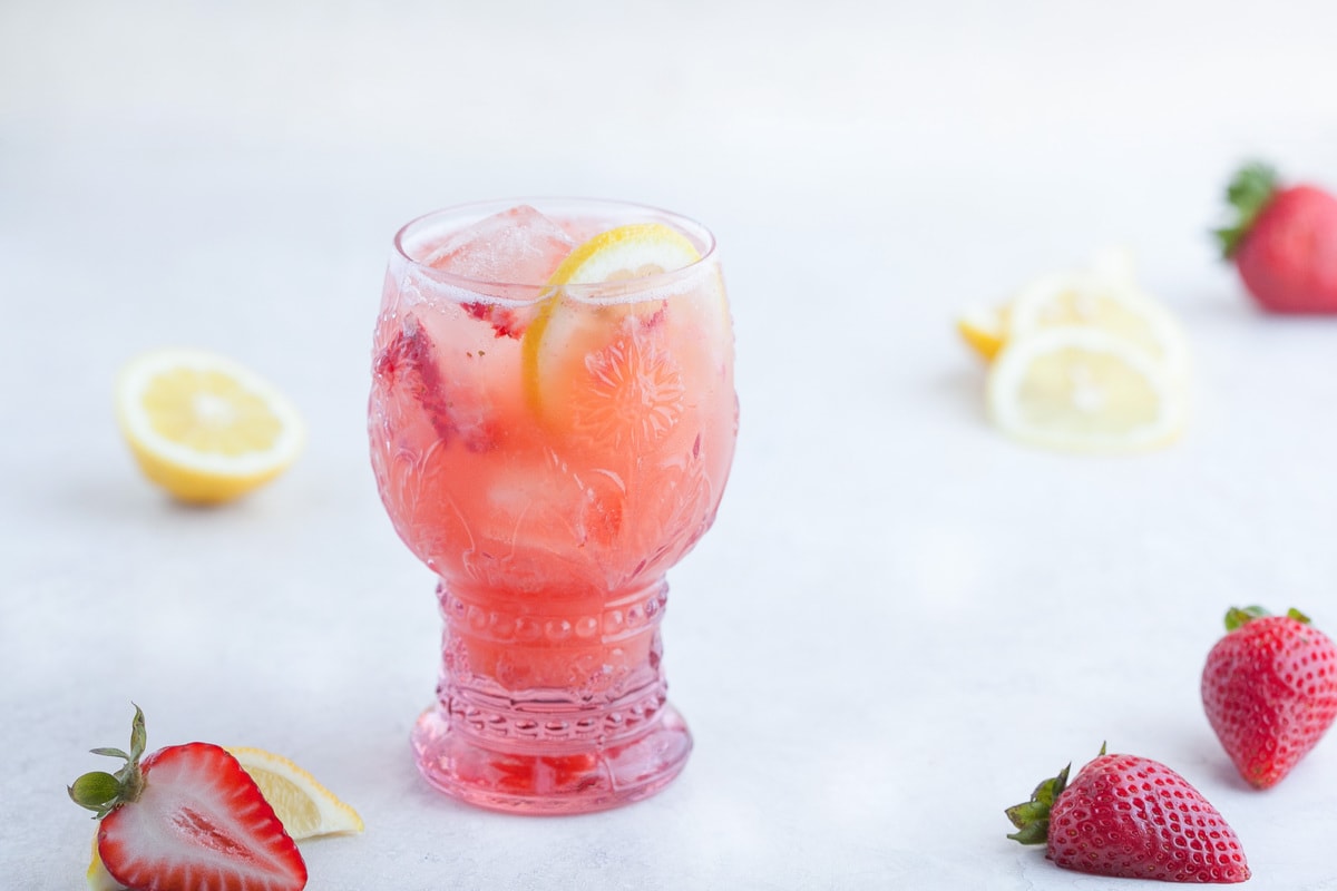 Frosty and delicious strawberry collagen lemonade margarita.
