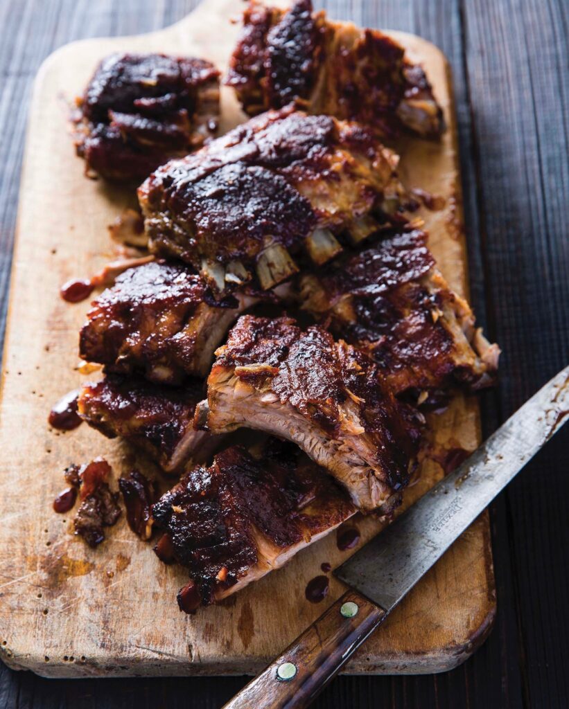 Pork Ribs sliced on a wooden cutting board