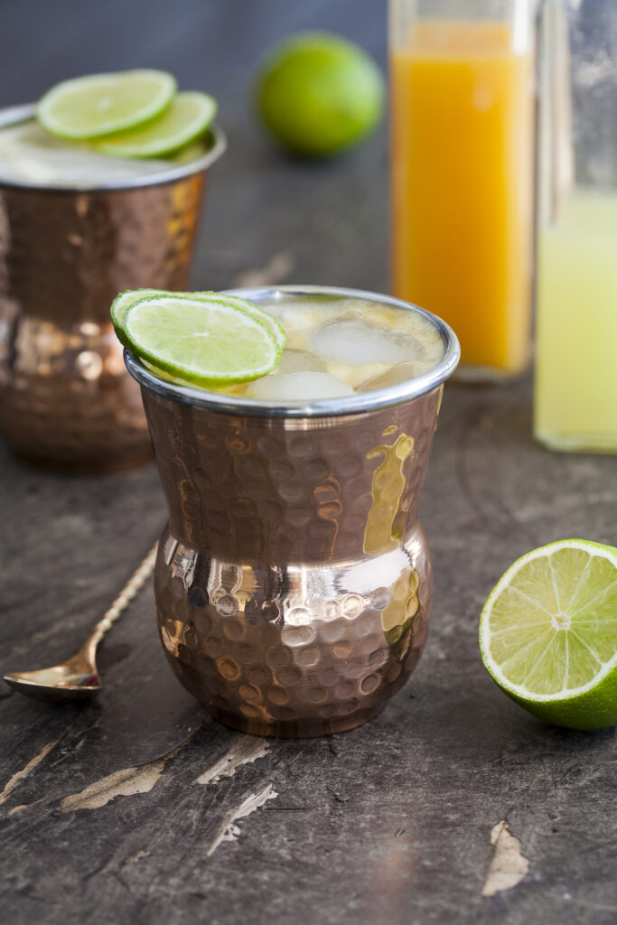 Paleo Mango Mule served in a copper mug, garnished with a lime