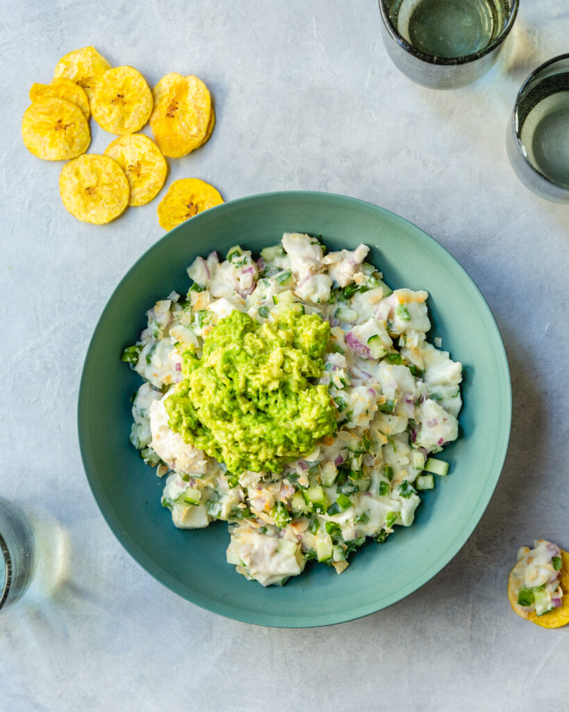 Hawaiian Ceviche in blue green bowl served with plantain chips