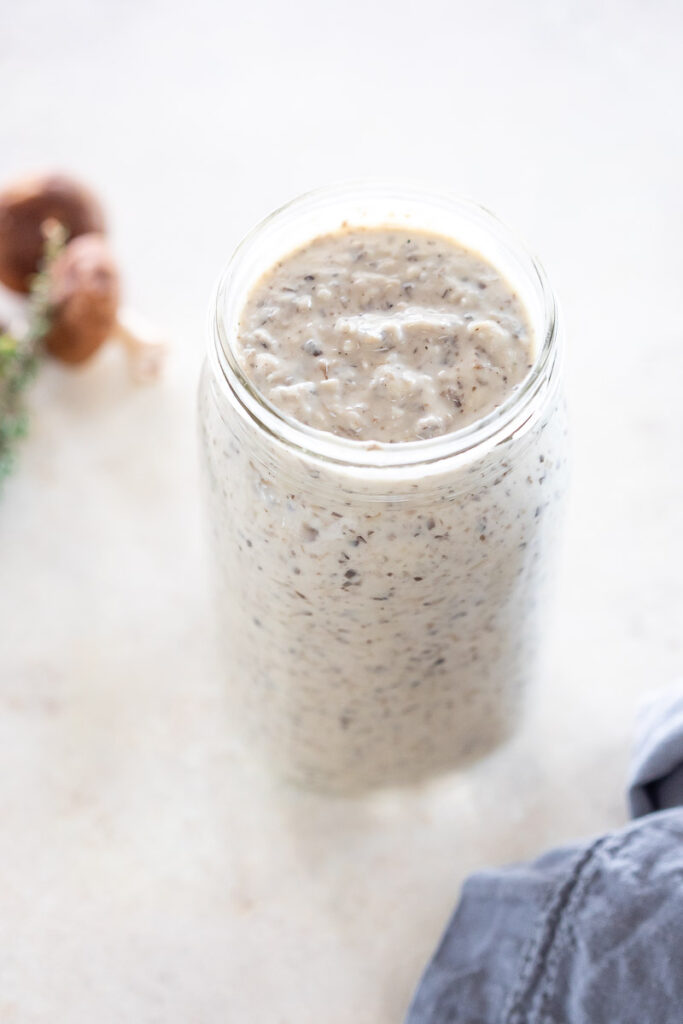 Dairy-Free Cream of Mushroom Soup in a jar that sits on a counter