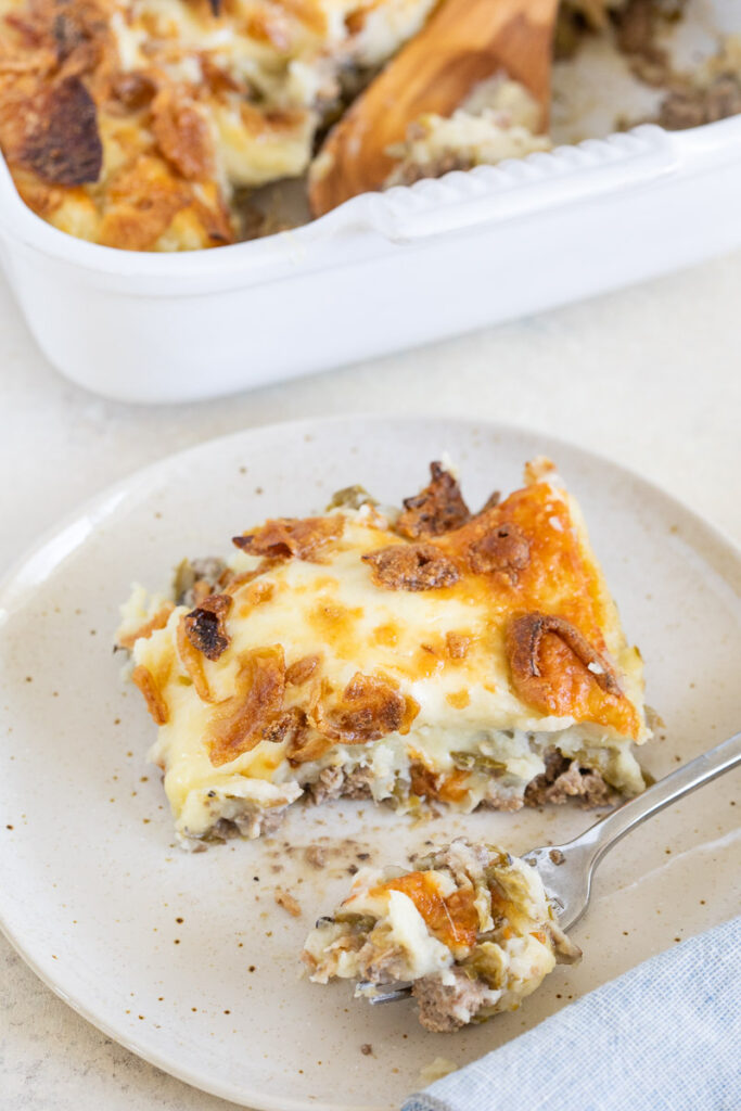 Gluten-Free Shepherd's Pie partially eaten on a small plate with a silver fork