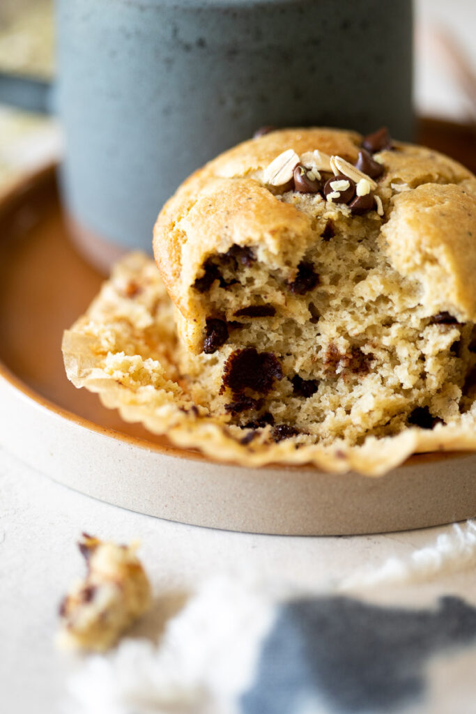 close up image of a bite taken out of a gluten free banana protein muffin