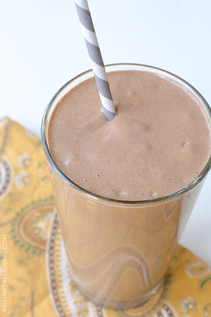 image of chocolate avocado smoothie in a glass with a straw