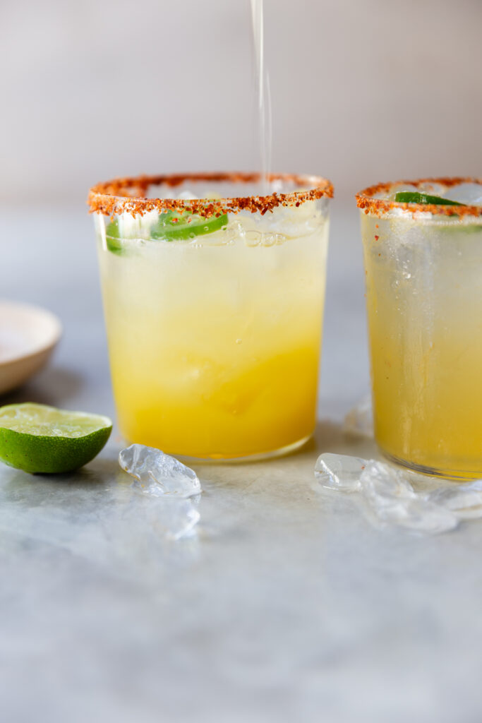 image of two glasses of margarita mocktails on a counter