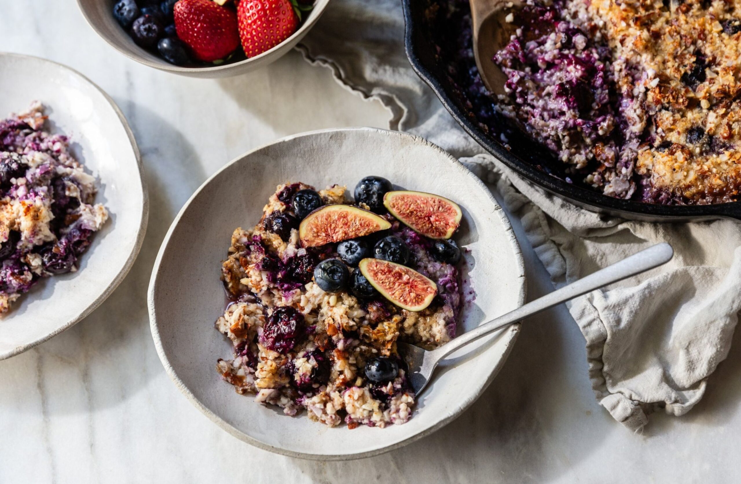 hero shot of paleo oatmeal in a a white bowl on the counter